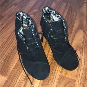 Black suade Toms booties.
